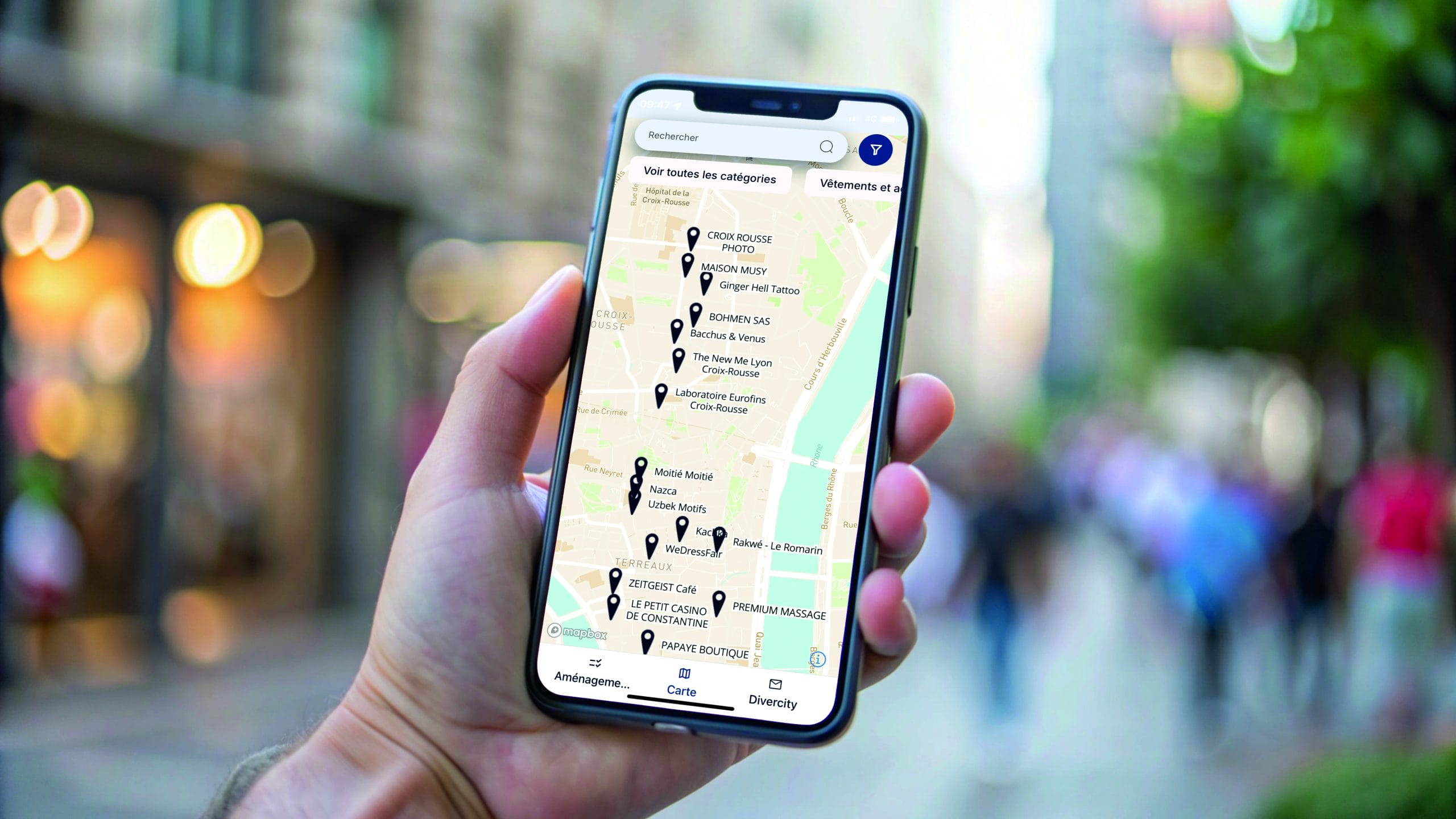 Hand holding smartphone with blank screen in city. Hand holding smartphone with blank screen in city.